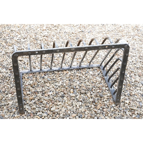 632 - Iron wall mounting hay rack, approx 67cm wide