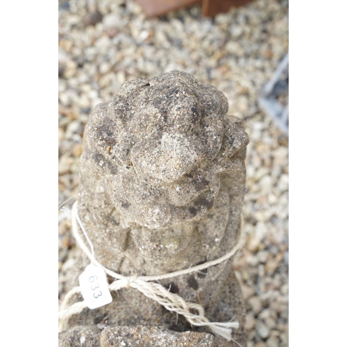 633 - Reconstituted stone garden sculpture in the form of a rampant lion holding a shield, approx 63cm hig... 