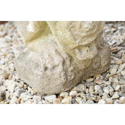 633 - Reconstituted stone garden sculpture in the form of a rampant lion holding a shield, approx 63cm hig... 