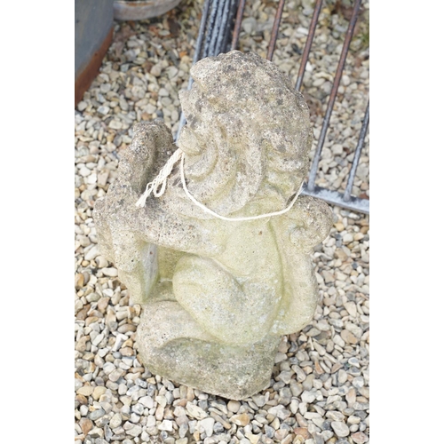 633 - Reconstituted stone garden sculpture in the form of a rampant lion holding a shield, approx 63cm hig... 