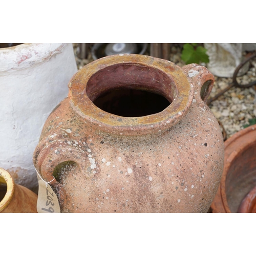 635 - Group of three terracotta garden urns / planters, the tallest approx 70cm