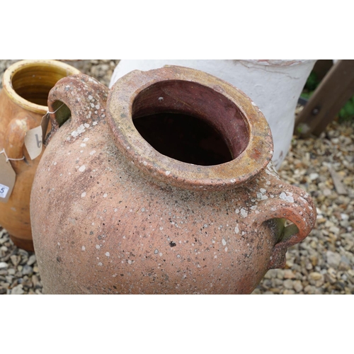 635 - Group of three terracotta garden urns / planters, the tallest approx 70cm