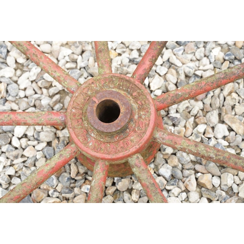 637 - Pair of Jarmain Haseley spoked iron red painted iron cart wheels, approx 111cm diameter