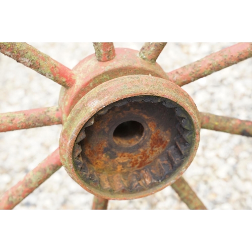 637 - Pair of Jarmain Haseley spoked iron red painted iron cart wheels, approx 111cm diameter