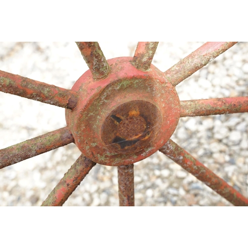 637 - Pair of Jarmain Haseley spoked iron red painted iron cart wheels, approx 111cm diameter