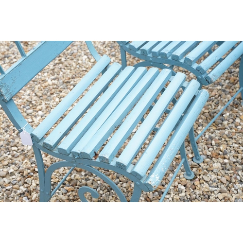 639 - Set of four blue painted slatted wooden garden patio chairs raised on metal legs with scrolled detai... 