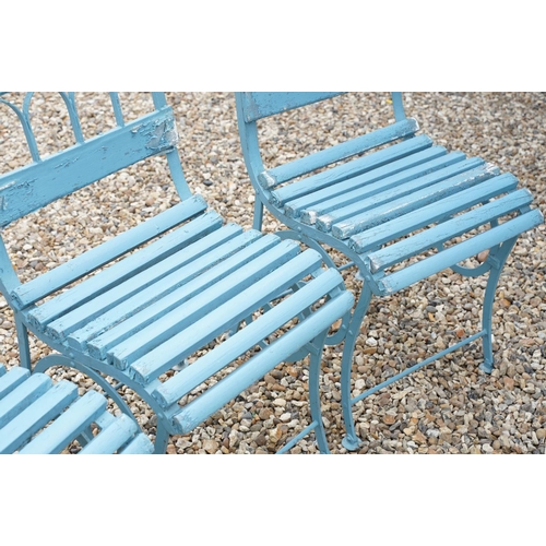 639 - Set of four blue painted slatted wooden garden patio chairs raised on metal legs with scrolled detai... 