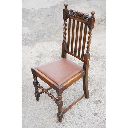 647 - Set of four oak dining chairs with barley twist supports and carved crown details to backs, with lea... 