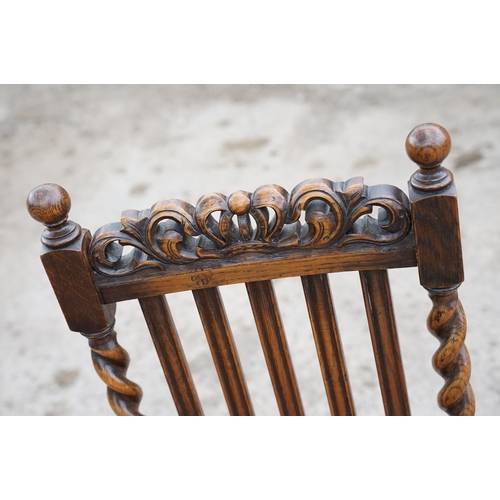 647 - Set of four oak dining chairs with barley twist supports and carved crown details to backs, with lea... 