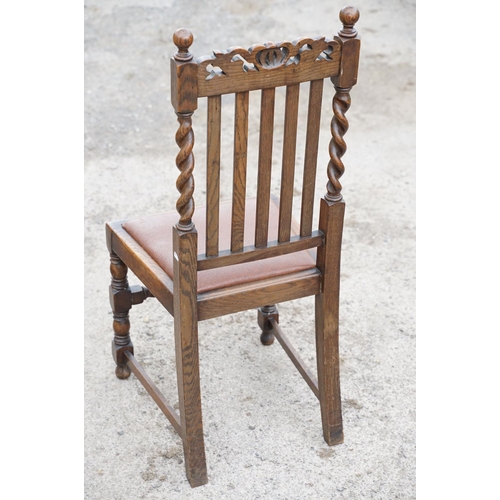 647 - Set of four oak dining chairs with barley twist supports and carved crown details to backs, with lea... 