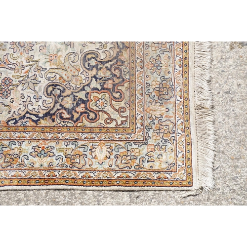 766 - Middle Eastern cream ground carpet, with central stylised motif within geometric borders, 160 x 92cm... 