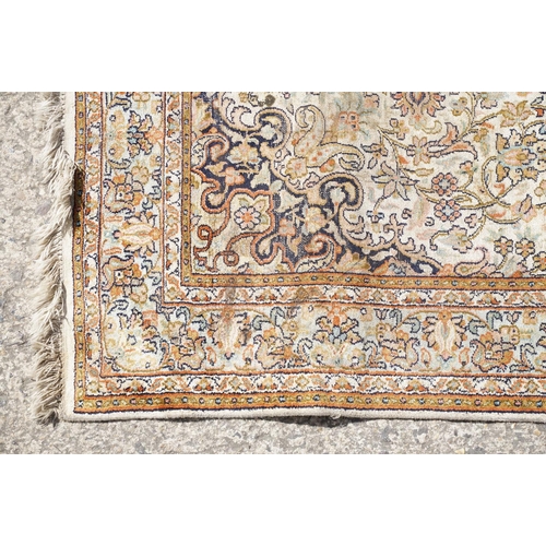 766 - Middle Eastern cream ground carpet, with central stylised motif within geometric borders, 160 x 92cm... 