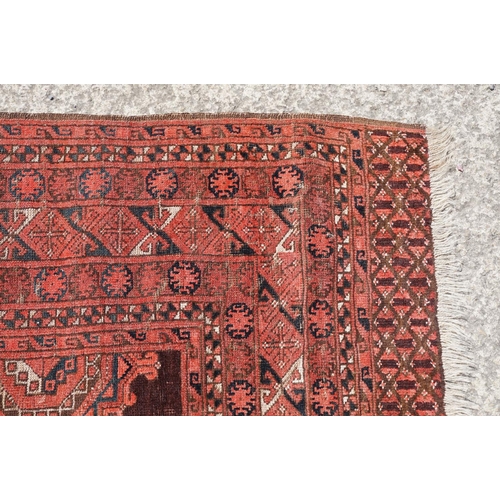 771 - Middle Eastern red ground carpet, with two central medallions within geometric borders, 216 x 140cm