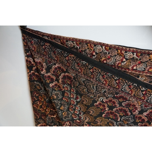 773 - Embroidery Karandi shawl with repeating design on a black ground, approx 222cm x 90cm