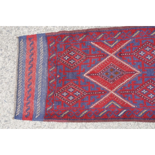 780 - Meshwani red & blue ground runner rug, approx 245cm x 61cm