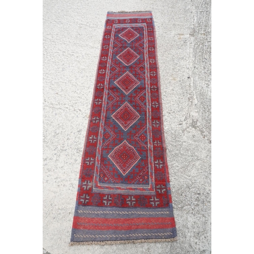 781 - Meshwani red & blue ground runner rug, approx 257cm x 54cm