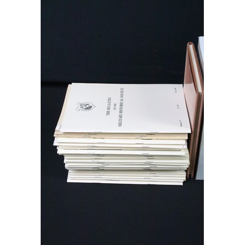 473A - Large collection of military reference books contained within four boxes