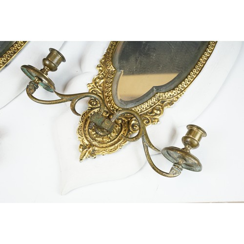 175 - Pair of gilt metal girondel wall mirrors with bevelled glass, each with two branch candle sconces, e... 