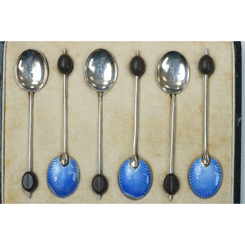 288 - A cased set of hallmarked sterling silver and enamel coffee bean spoons together a silver mounted bu... 