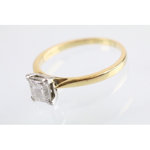 10 - 18ct gold and platinum diamond solitaire ring. The ring being set with a rectangular princess cut di... 