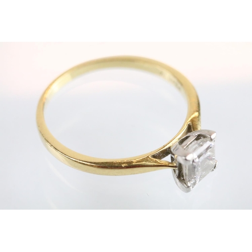 10 - 18ct gold and platinum diamond solitaire ring. The ring being set with a rectangular princess cut di... 