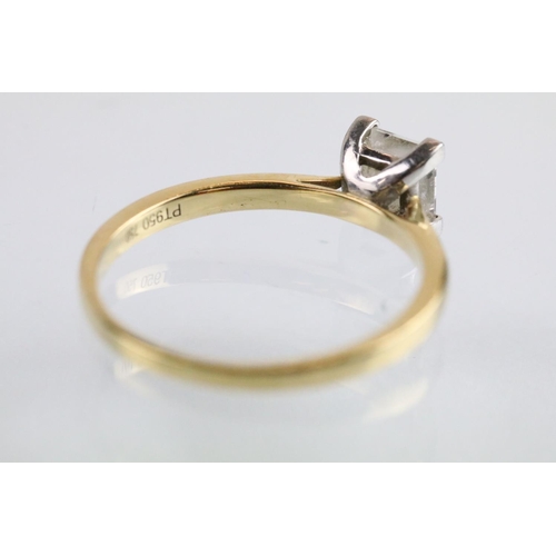 10 - 18ct gold and platinum diamond solitaire ring. The ring being set with a rectangular princess cut di... 