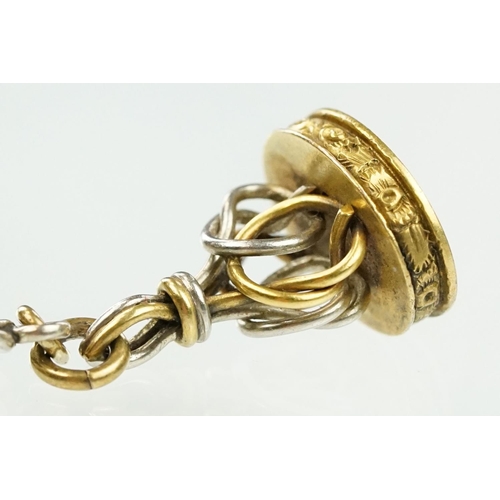 12 - 15ct gold pocket watch fob seal on chain. The fob having a two tone wire design mounted to four curb... 