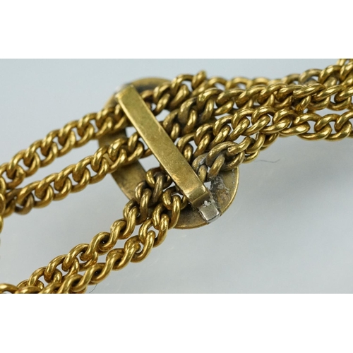 12 - 15ct gold pocket watch fob seal on chain. The fob having a two tone wire design mounted to four curb... 