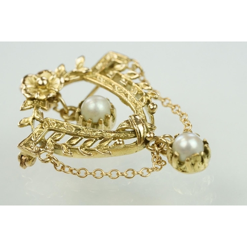 16 - 14ct gold and cultured pearl floral garland brooch. The brooch in the form of a U shaped foliate gar... 