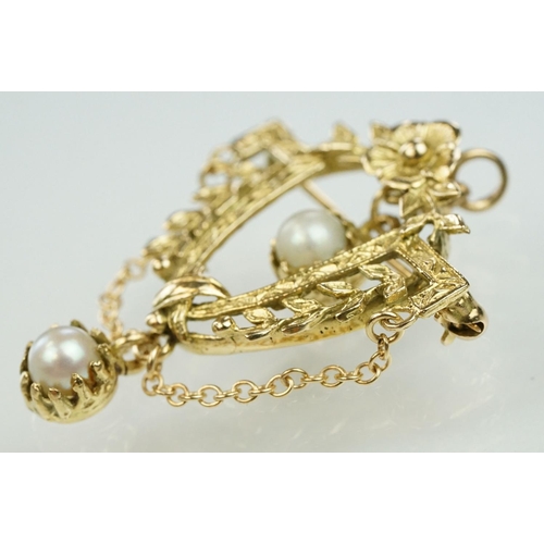 16 - 14ct gold and cultured pearl floral garland brooch. The brooch in the form of a U shaped foliate gar... 