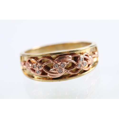 17 - Clogau two tone 9ct gold ring having a pierced foliate knot to head set with diamond accent stones. ... 