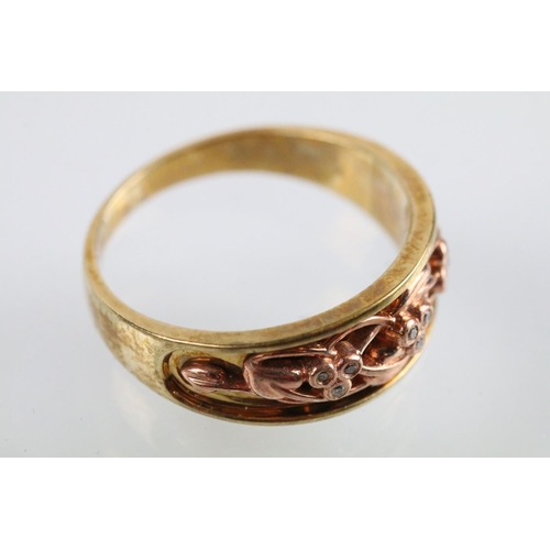 17 - Clogau two tone 9ct gold ring having a pierced foliate knot to head set with diamond accent stones. ... 