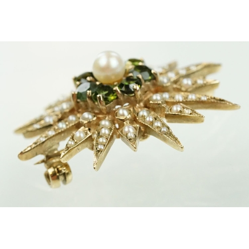 20 - 9ct gold hallmarked green stone and star brooch. The brooch set with a round pearl to the centre sur... 