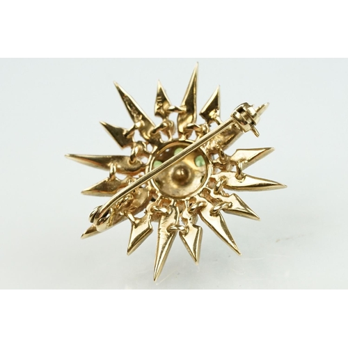 20 - 9ct gold hallmarked green stone and star brooch. The brooch set with a round pearl to the centre sur... 