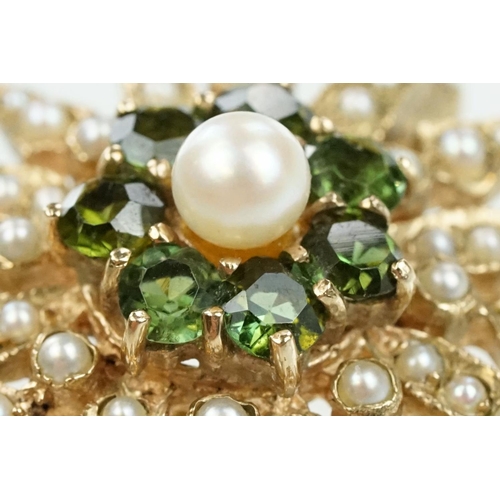 20 - 9ct gold hallmarked green stone and star brooch. The brooch set with a round pearl to the centre sur... 