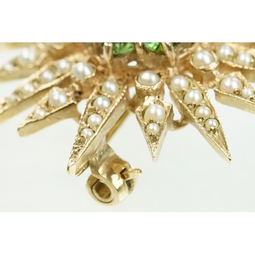 20 - 9ct gold hallmarked green stone and star brooch. The brooch set with a round pearl to the centre sur... 