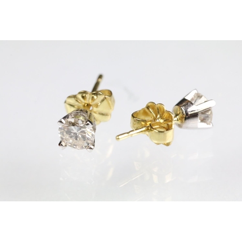 27 - Pair of diamond stud earrings with 18ct gold posts. Each diamond estimated 0.30ct, 0.60ct in total. ... 