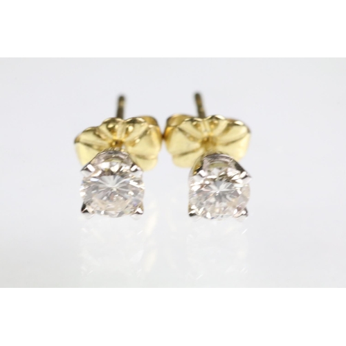 27 - Pair of diamond stud earrings with 18ct gold posts. Each diamond estimated 0.30ct, 0.60ct in total. ... 