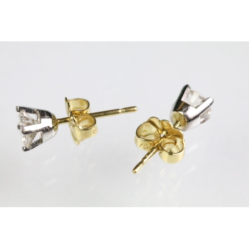 27 - Pair of diamond stud earrings with 18ct gold posts. Each diamond estimated 0.30ct, 0.60ct in total. ... 