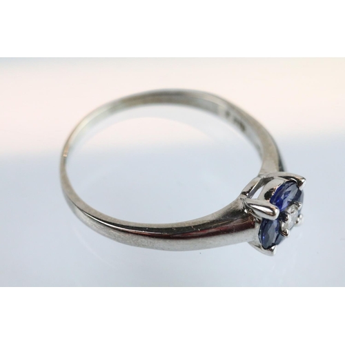 28 - 18ct white gold diamond and synthetic sapphire cluster ring being set with a round brilliant cut dia... 