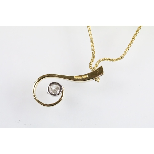 30 - 18ct gold and diamond pendant necklace. The pendant of swirl design being set with a round fancy cut... 