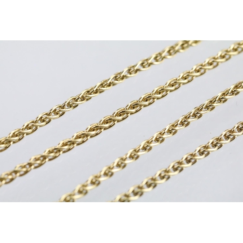 30 - 18ct gold and diamond pendant necklace. The pendant of swirl design being set with a round fancy cut... 