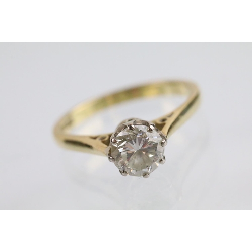 31 - 18ct gold and diamond solitaire ring. The ring set with a round brilliant cut diamond in a cathedral... 