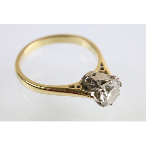 31 - 18ct gold and diamond solitaire ring. The ring set with a round brilliant cut diamond in a cathedral... 