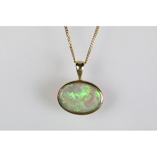 42 - 14ct gold opal pendant set to a 9ct gold fine link chain together with a pair of 14ct gold and opal ... 