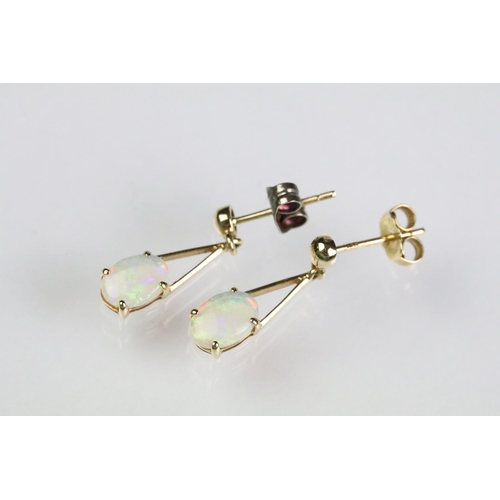 42 - 14ct gold opal pendant set to a 9ct gold fine link chain together with a pair of 14ct gold and opal ... 