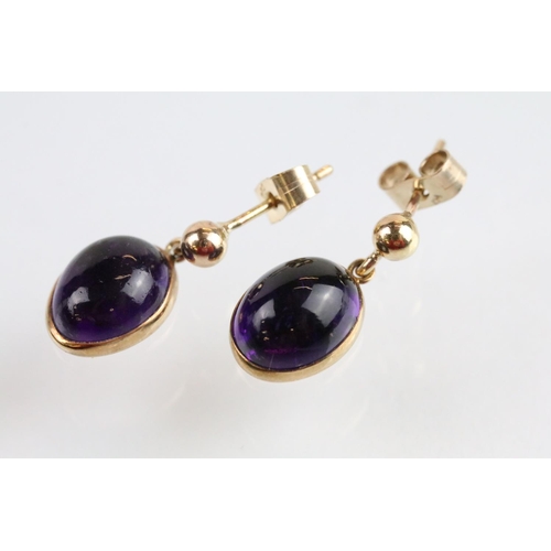 44 - 9ct gold and amethyst necklace, bracelet, earrings and ring. Each piece being set with amethyst cabo... 