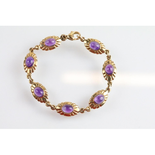 44 - 9ct gold and amethyst necklace, bracelet, earrings and ring. Each piece being set with amethyst cabo... 