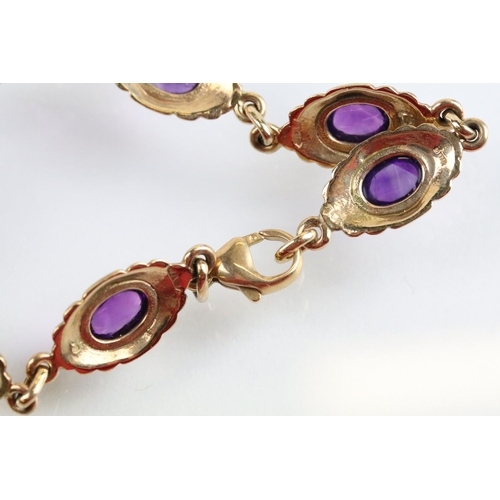 44 - 9ct gold and amethyst necklace, bracelet, earrings and ring. Each piece being set with amethyst cabo... 