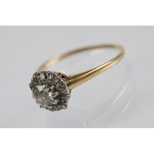 50 - Early 20th Century diamond cluster ring. The ring being set with an old round cut diamond to centre ... 